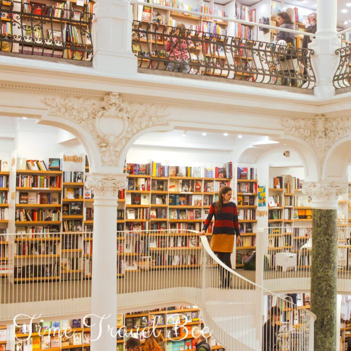 Carousel Bookstore. Bucharest. Bookstore bucharest, carousel bookstore, white columns, books, girl walking down the stairs. Colorful background, colorful clothes.