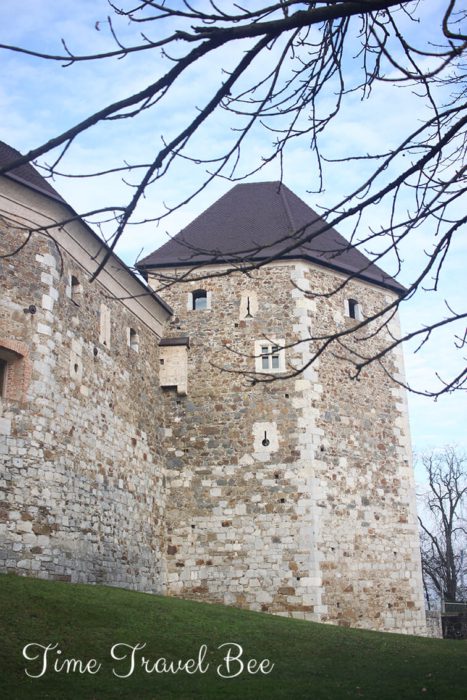 The castle in Ljublana, Slovenia on the castle hill. Stone castle from medieval times. Park on the castle hill in Ljubljana.