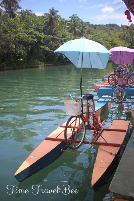Water bikes in Bohol with umbrella and basket. Lobok River, Philippines.