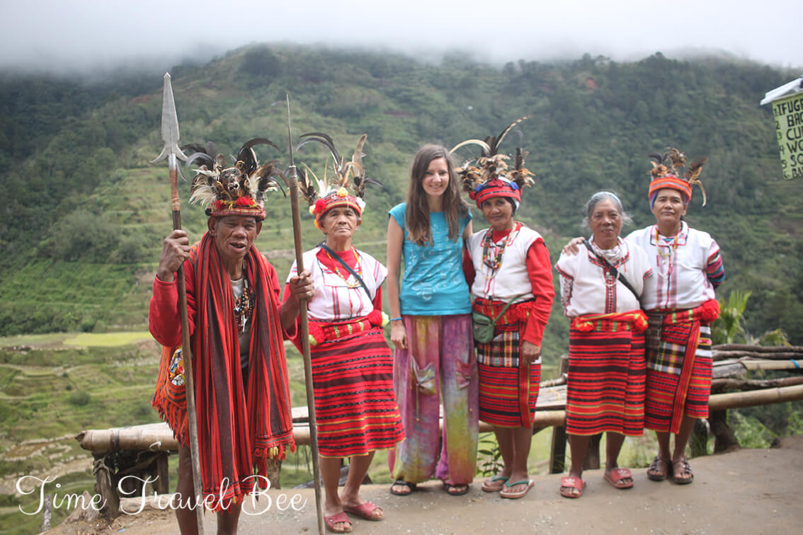 Banaue Rice Terraces with Igorot people in traditional costiumes.